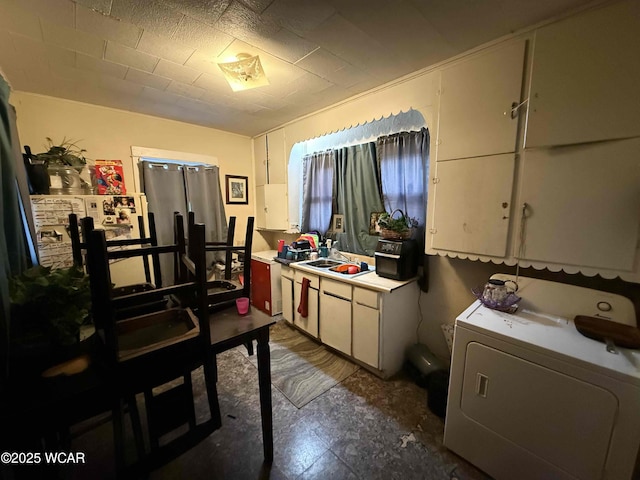 interior space featuring washer / dryer and sink