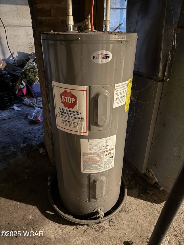 utility room featuring water heater