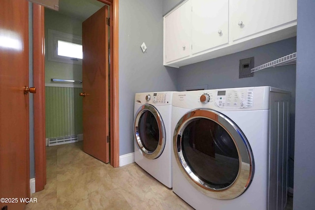 clothes washing area featuring cabinet space, independent washer and dryer, and baseboards