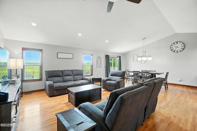 13286 Arrowhead Dr, Findlay, OH 45840 - living room with vaulted ceiling, light wood finished floors, a ceiling fan, a chandelier, and recessed lighting