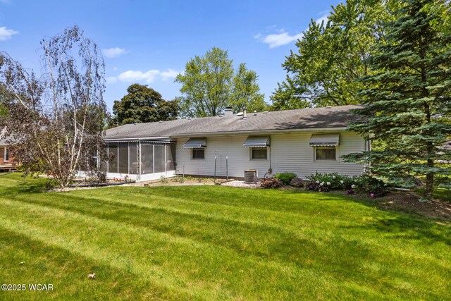3540 Yoakam Rd, Lima, OH 45806 - back of property featuring a sunroom and a yard