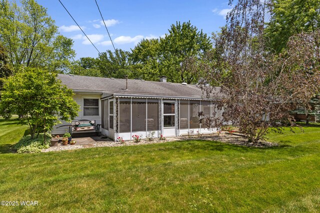 3540 Yoakam Rd, Lima, OH 45806 - rear view of house with a sunroom, a yard, and a shingled roof