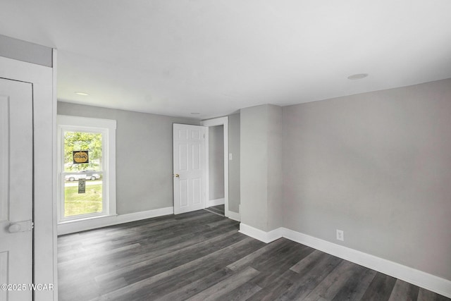 526 S Pine St, Lima, OH 45804 - spare room featuring dark wood-style flooring and baseboards