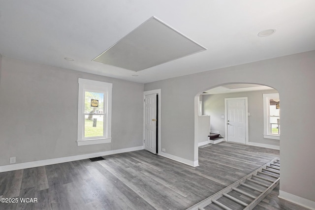 526 S Pine St, Lima, OH 45804 - unfurnished room featuring arched walkways, wood finished floors, and baseboards