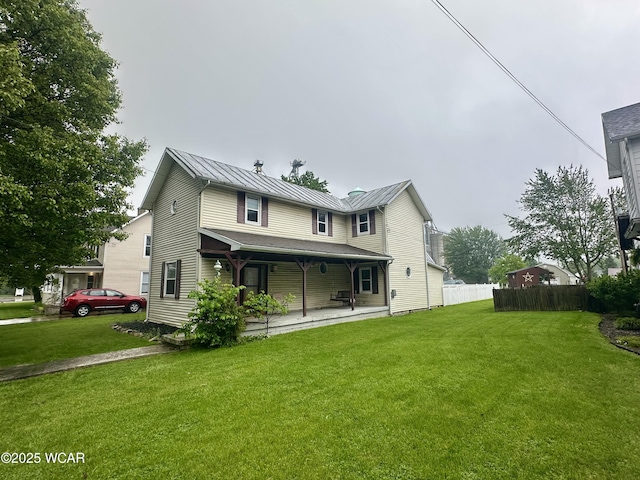309 E Main Cross St, Arlington, OH 45814 - back of property featuring a standing seam roof, metal roof, and covered porch