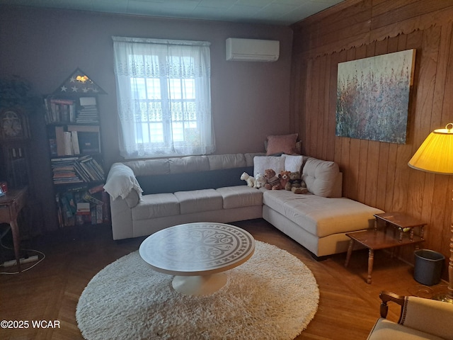 living room with a wall mounted AC and wood walls