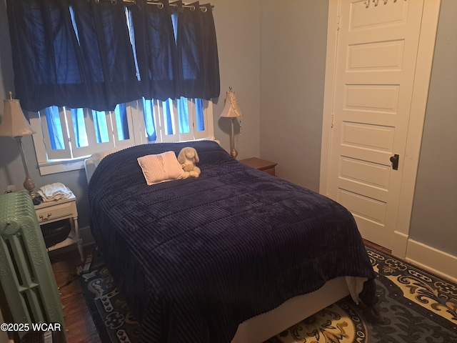 bedroom featuring dark hardwood / wood-style floors