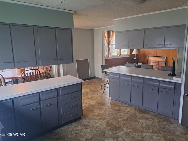 kitchen featuring ornamental molding, stainless steel appliances, and gray cabinets