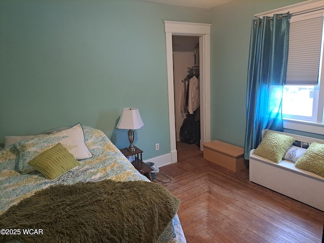 bedroom featuring parquet flooring