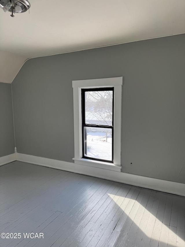 bonus room featuring hardwood / wood-style flooring and vaulted ceiling