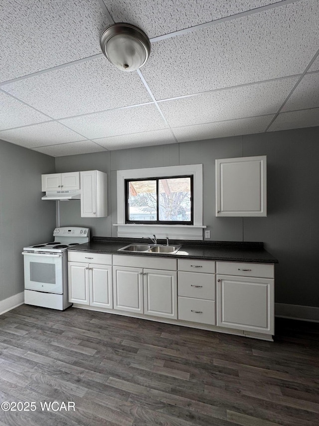 kitchen featuring electric range, sink, a paneled ceiling, white cabinets, and dark hardwood / wood-style floors