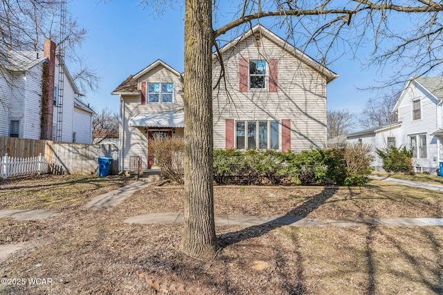 view of front of house with fence