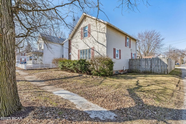 view of property exterior featuring fence