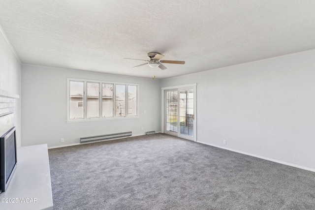 unfurnished living room featuring a baseboard heating unit, crown molding, a fireplace, and carpet floors