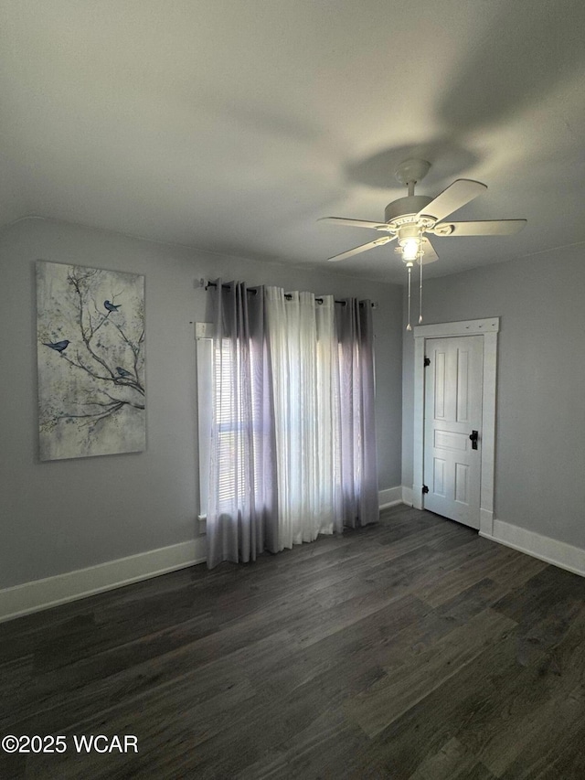 110 Heisel St, Kenton, OH 43326 - spare room featuring a ceiling fan and dark wood-style flooring