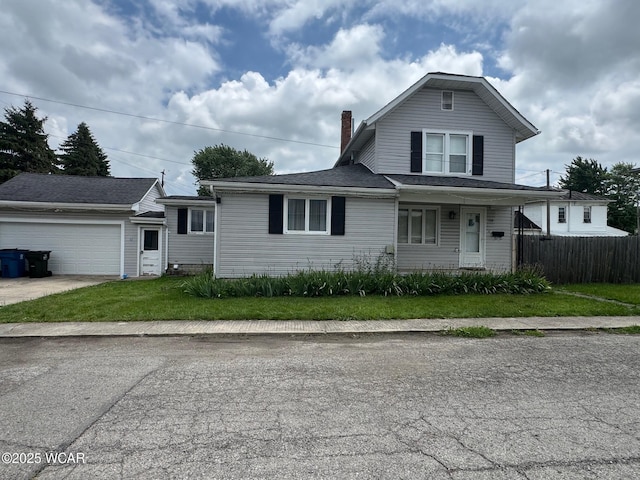 110 Heisel St, Kenton, OH 43326 - traditional-style home with a chimney, a garage, an outbuilding, and concrete driveway