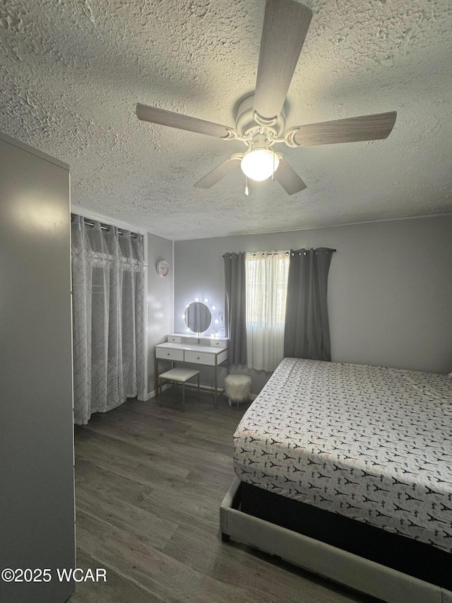 110 Heisel St, Kenton, OH 43326 - bedroom featuring a textured ceiling, wood finished floors, and ceiling fan