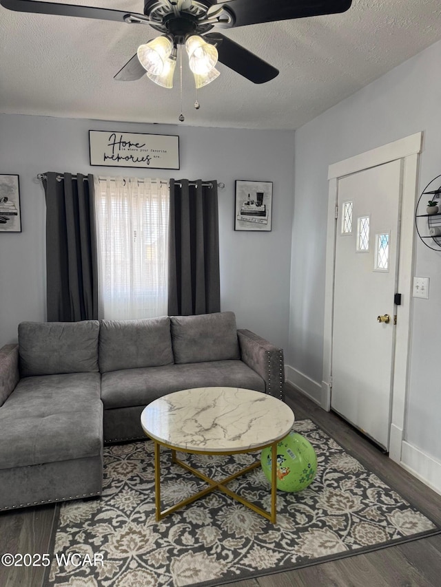 110 Heisel St, Kenton, OH 43326 - living area with wood finished floors, a ceiling fan, and a textured ceiling