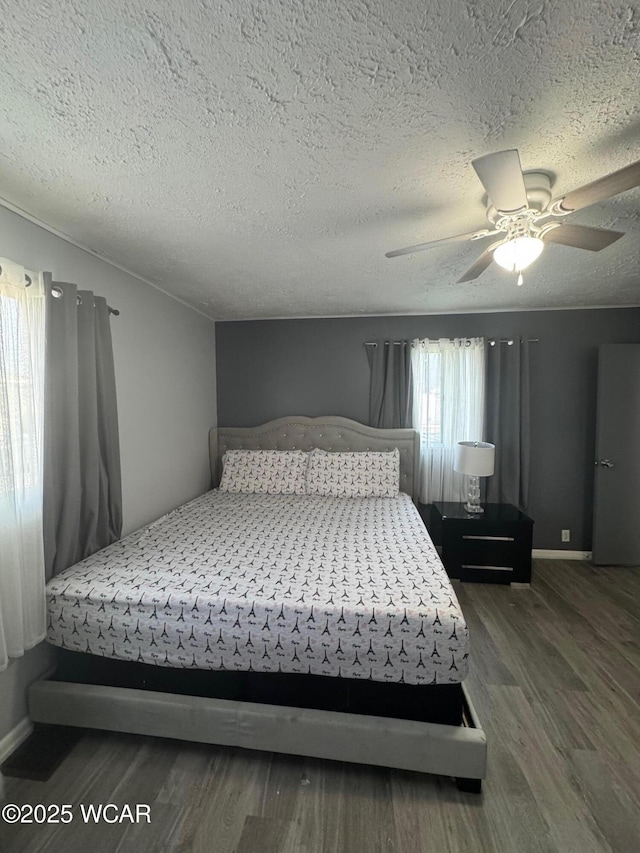 110 Heisel St, Kenton, OH 43326 - bedroom with wood finished floors, a textured ceiling, and ceiling fan
