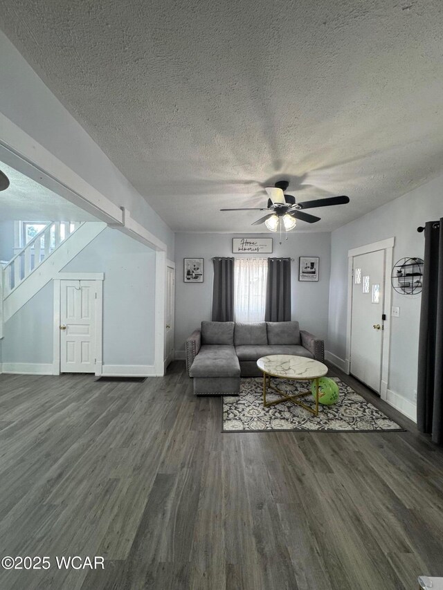 110 Heisel St, Kenton, OH 43326 - living area with a ceiling fan, a textured ceiling, wood finished floors, and stairs