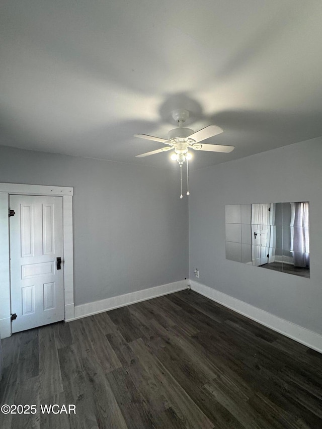 110 Heisel St, Kenton, OH 43326 - empty room featuring a ceiling fan and dark wood-style floors