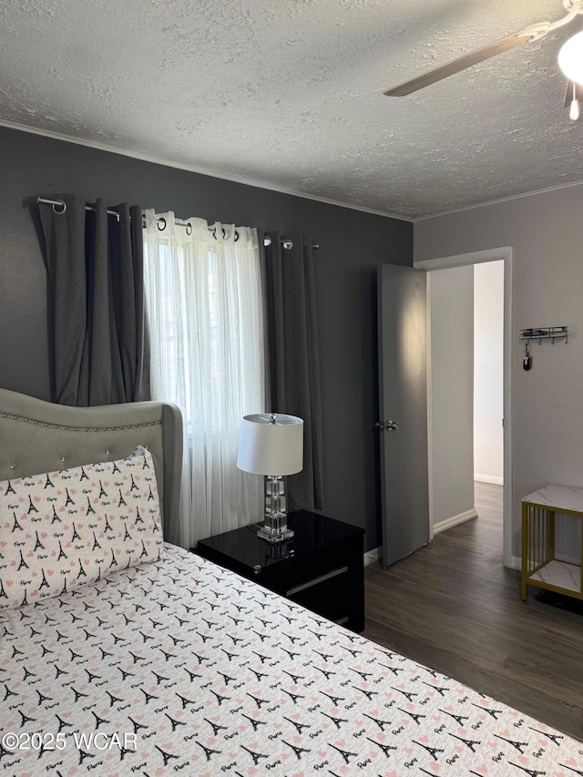 110 Heisel St, Kenton, OH 43326 - bedroom with wood finished floors and a textured ceiling