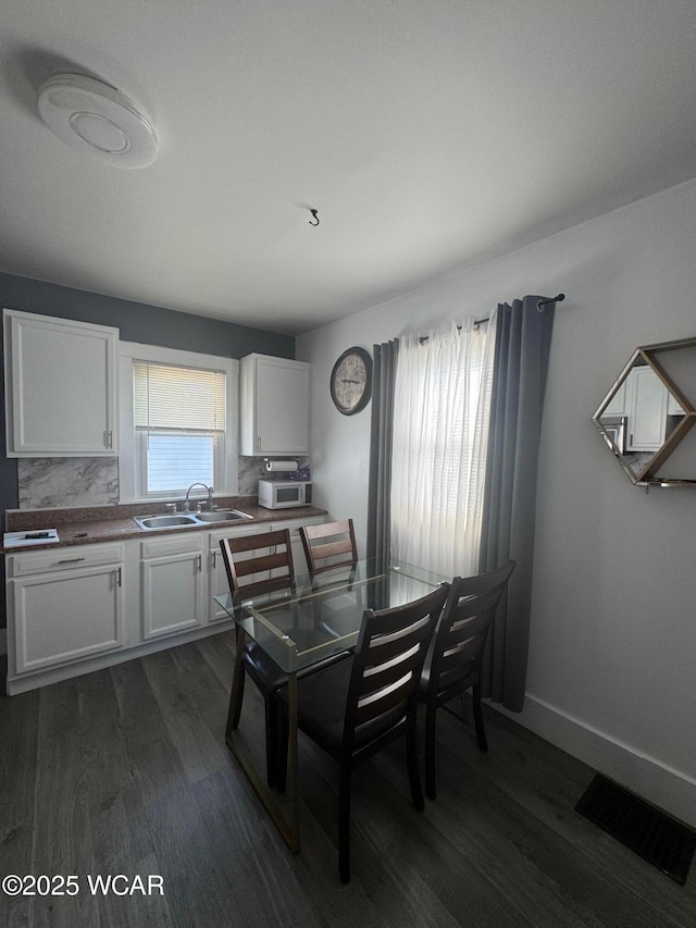 110 Heisel St, Kenton, OH 43326 - dining area featuring dark wood-style floors