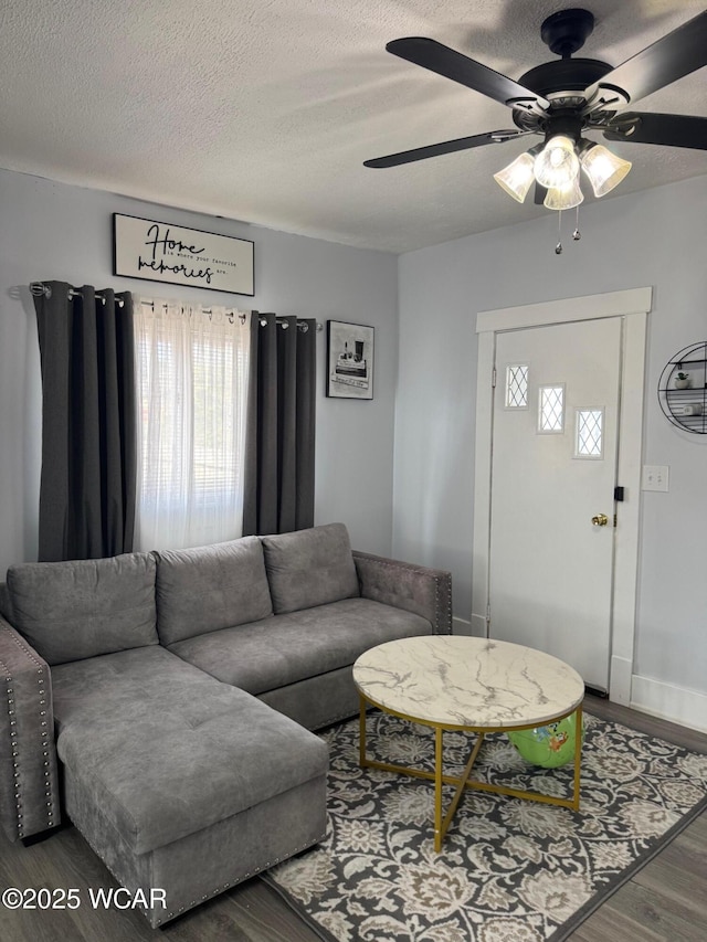 110 Heisel St, Kenton, OH 43326 - living area with wood finished floors, a ceiling fan, and a textured ceiling
