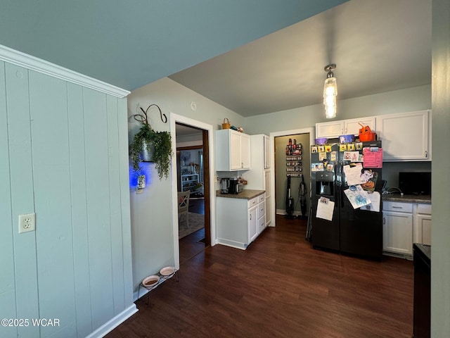119 E N St, Kenton, OH 43326 - kitchen featuring black fridge, dark wood-style floors, white cabinetry, and dark countertops