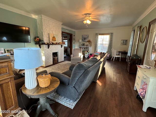 119 E N St, Kenton, OH 43326 - living room featuring dark wood-type flooring, a ceiling fan, crown molding, and a brick fireplace