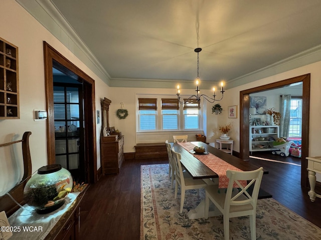 119 E N St, Kenton, OH 43326 - dining space featuring a chandelier, healthy amount of natural light, ornamental molding, and dark wood-style flooring