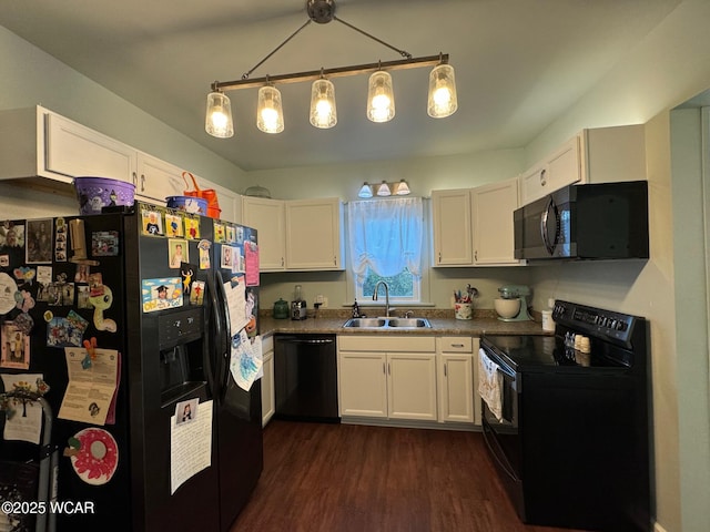 119 E N St, Kenton, OH 43326 - kitchen with black appliances, dark wood-type flooring, white cabinets, and dark countertops