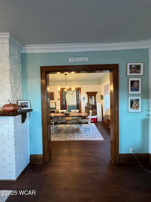 119 E N St, Kenton, OH 43326 - hall with crown molding, dark wood finished floors, and a chandelier