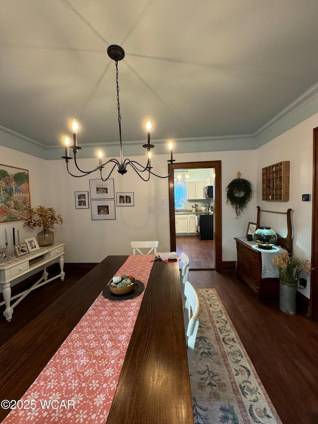 119 E N St, Kenton, OH 43326 - dining space featuring ornamental molding, dark wood-type flooring, and a chandelier