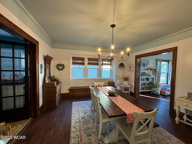 119 E N St, Kenton, OH 43326 - dining area featuring a chandelier, plenty of natural light, dark wood-style floors, and crown molding