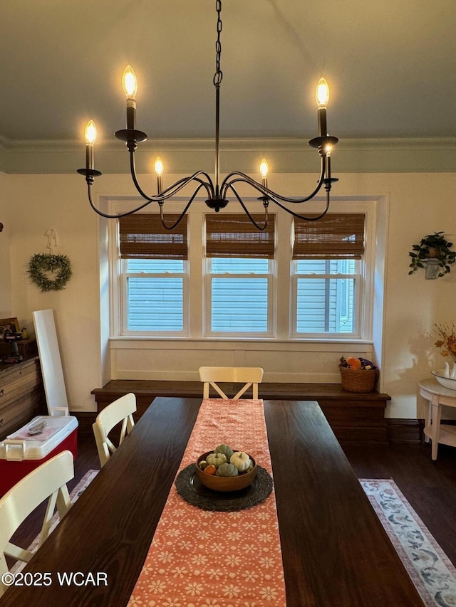 119 E N St, Kenton, OH 43326 - dining space with ornamental molding, a chandelier, and wood finished floors