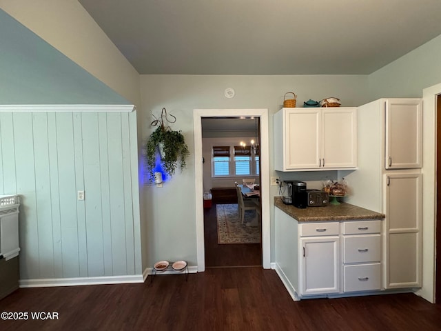 119 E N St, Kenton, OH 43326 - kitchen featuring dark wood finished floors, white cabinetry, and dark countertops