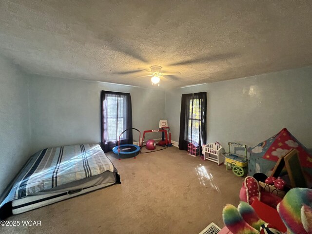 314 N Market St, Kenton, OH 43326 - unfurnished bedroom with a textured ceiling, carpet floors, and ceiling fan