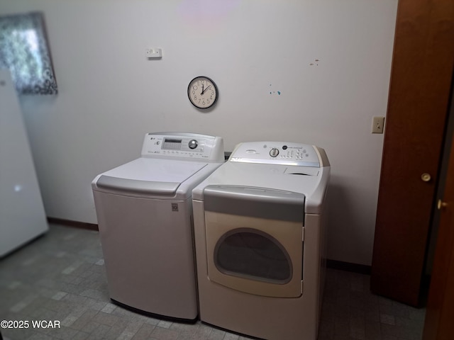 10510 Shenk Rd, Delphos, OH 45833 - washroom featuring separate washer and dryer and baseboards