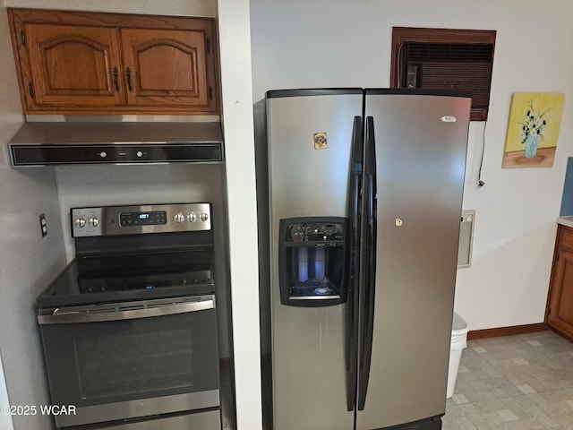 10510 Shenk Rd, Delphos, OH 45833 - kitchen with appliances with stainless steel finishes, range hood, brown cabinets, and baseboards