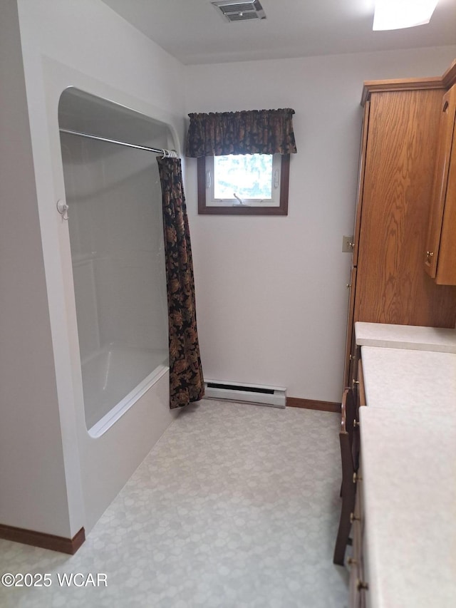 10510 Shenk Rd, Delphos, OH 45833 - full bathroom featuring a baseboard radiator, vanity, baseboards, and shower / bath combo