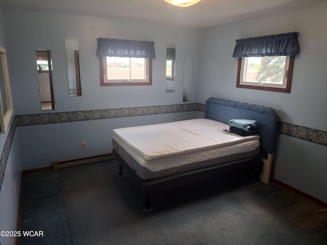 10510 Shenk Rd, Delphos, OH 45833 - carpeted bedroom with a baseboard heating unit