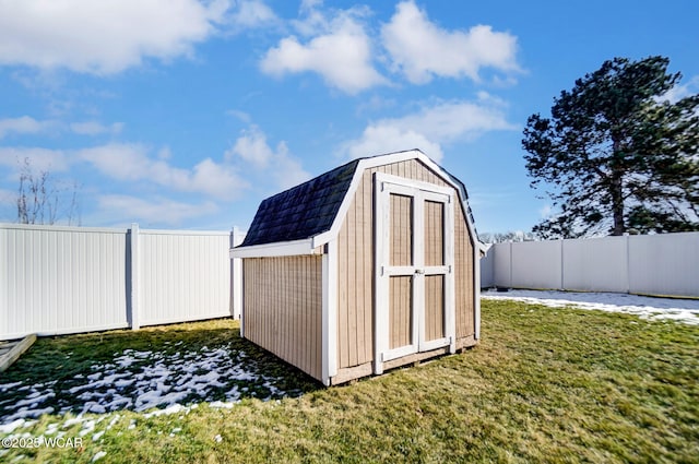 view of outdoor structure featuring a lawn