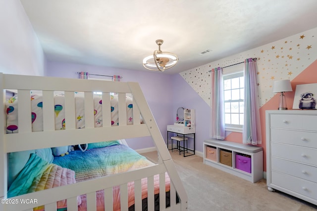 bedroom featuring light carpet