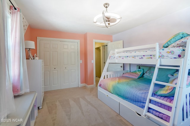 carpeted bedroom featuring a closet