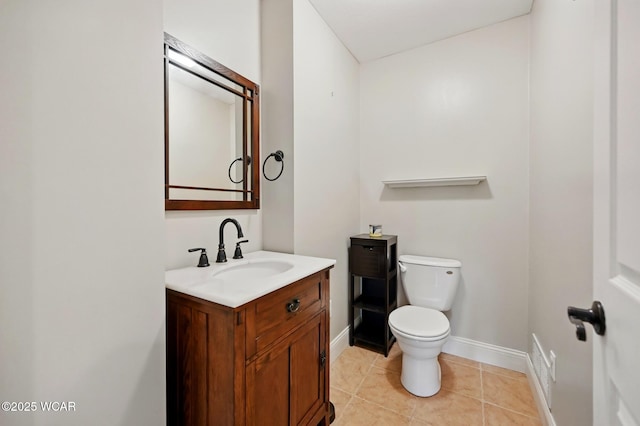1106 S Grubb Rd, Lima, OH 45806 - bathroom featuring toilet, vanity, baseboards, and tile patterned flooring