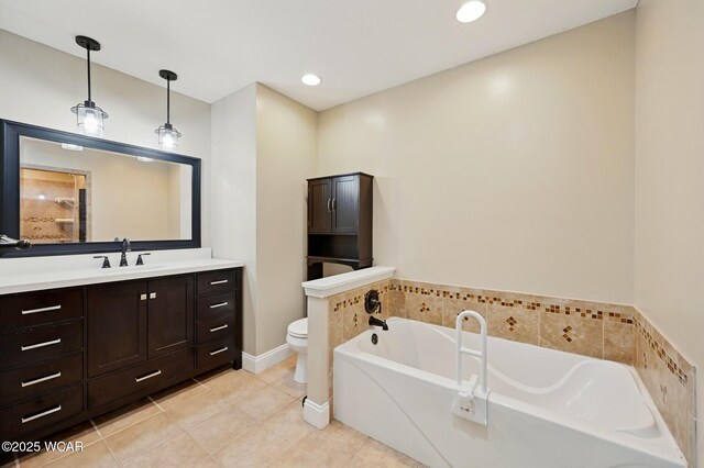 1106 S Grubb Rd, Lima, OH 45806 - bathroom featuring a bathtub, toilet, tile patterned floors, vanity, and recessed lighting