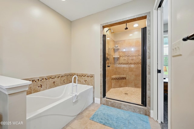 1106 S Grubb Rd, Lima, OH 45806 - full bath with a stall shower, a garden tub, and tile patterned flooring