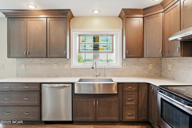 1106 S Grubb Rd, Lima, OH 45806 - kitchen featuring appliances with stainless steel finishes, a sink, decorative backsplash, and light countertops
