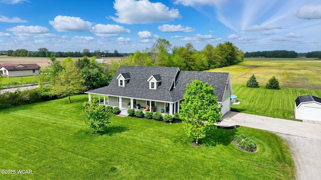 1106 S Grubb Rd, Lima, OH 45806 - view of front of home featuring a porch, a front yard, concrete driveway, and a shingled roof